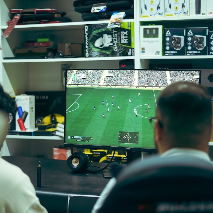 Two players head to head in an ea sports fc 26 match at the advapes fc26 tournament