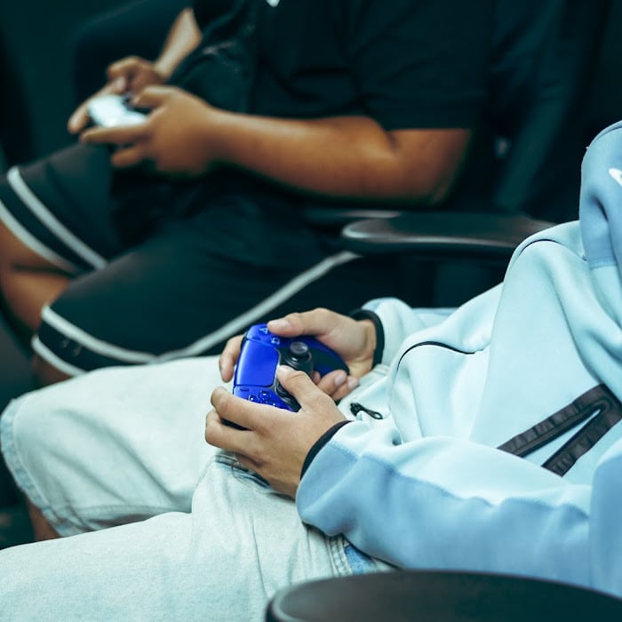 Players on the controllers during the advapes fc26 tournament